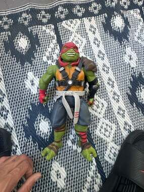 Playmates Teenage Mutant Ninja Turtles  Raphael 11-Inch Deluxe Action Figure